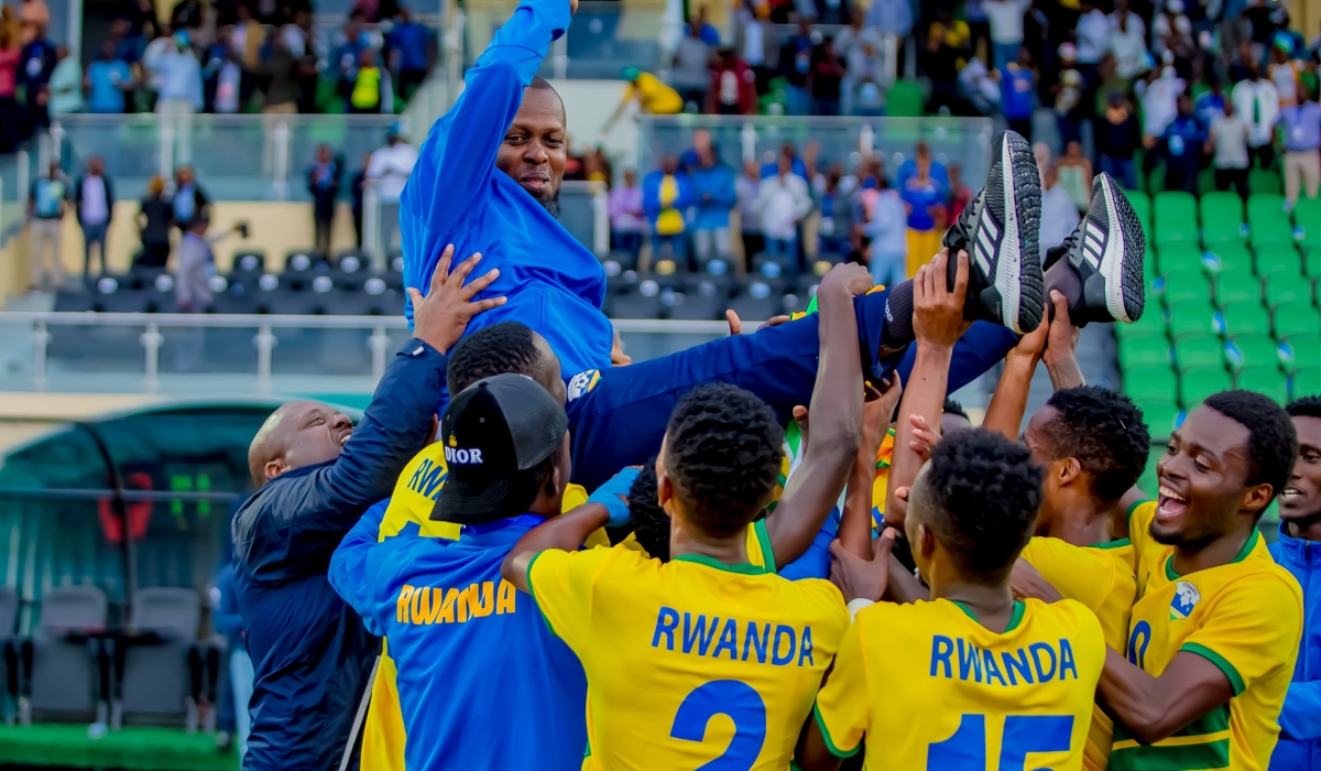 U-23 head coach Yves Rwasamanzi and his players during the celebration after eliminating Libya. / Courtesy