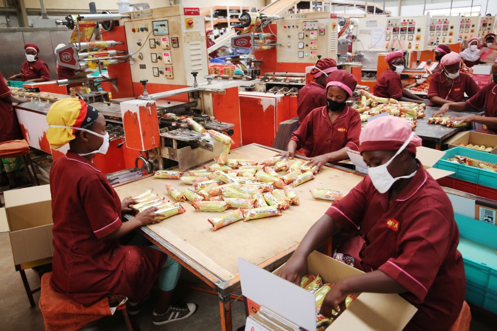 Workers packaging biscuits at ADMA International Ltd at Kigali Special Economic Zone on May 6, 2021. The Fund for Export Development in Africa has raised $670m to boost trade in Africa. According to Afreximbank, the financing will specifically go towards promoting industrialisation, value added export development and intra-African trade.  Photo: Craish Bahizi. 