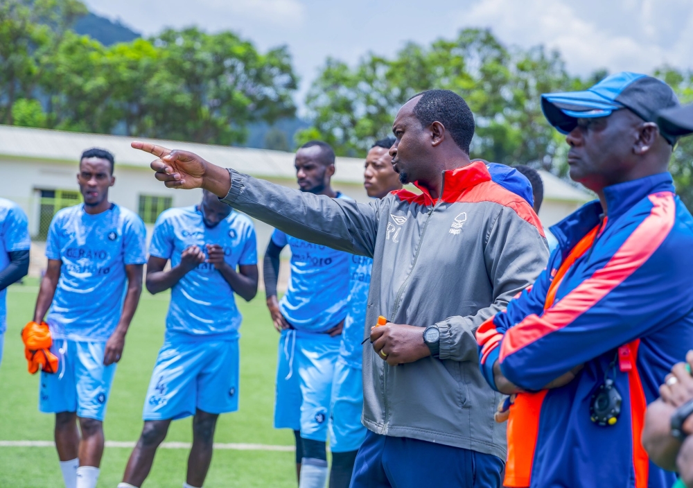 Police FC coach Vincent Mashami (center) talks to his players during a recent training session. The 40-year-old former Amavubi coach is under intense pressure after failing to pick up a win in the last three matches of the league season. Photo: Courtesy.