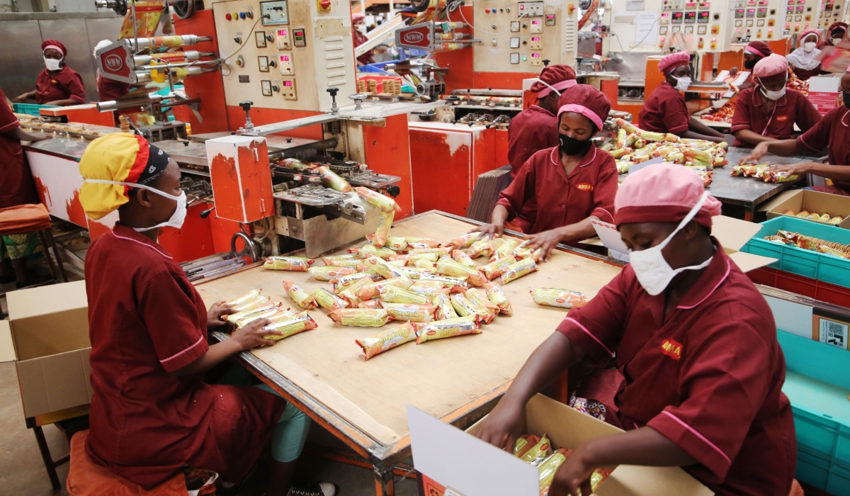 Workers packaging biscuits at ADMA International Ltd at Kigali Special Economic Zone on May 6, 2021. The Fund for Export Development in Africa has raised $670m to boost trade in Africa. According to Afreximbank, the financing will specifically go towards promoting industrialisation, value added export development and intra-African trade.  Photo: Craish Bahizi. 
