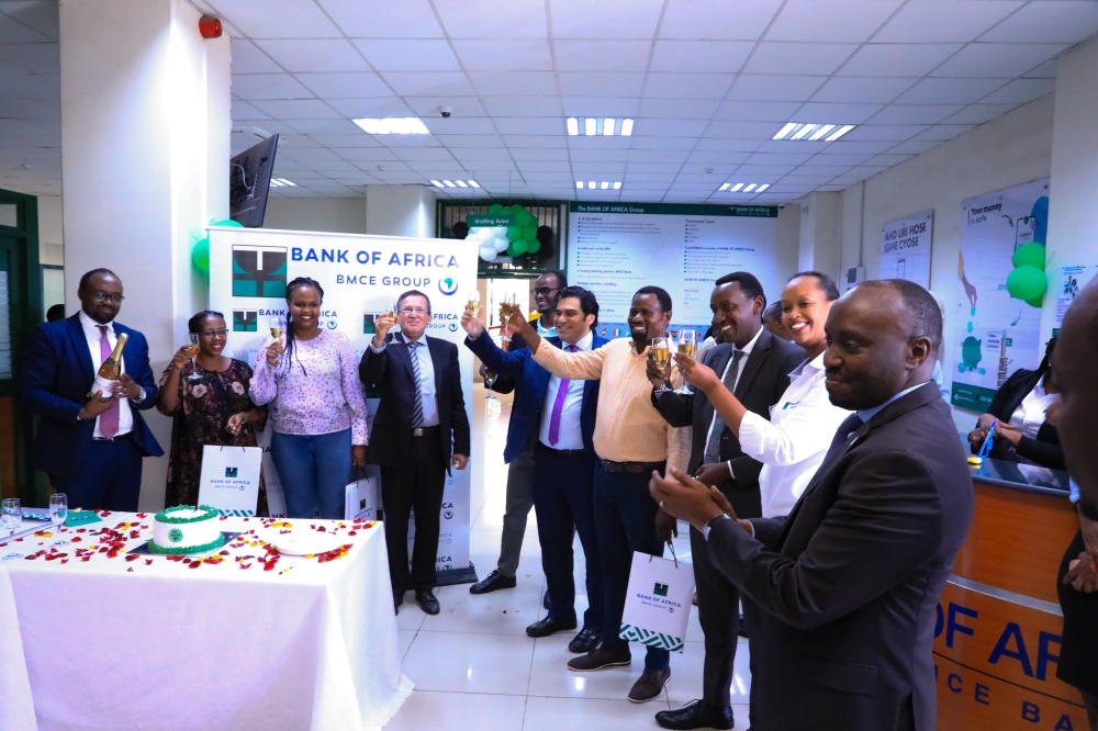 Bank officials toast with their customers during the celebration of Customer Service week in Kigali on October 6. All photos: Dan Gatsinzi