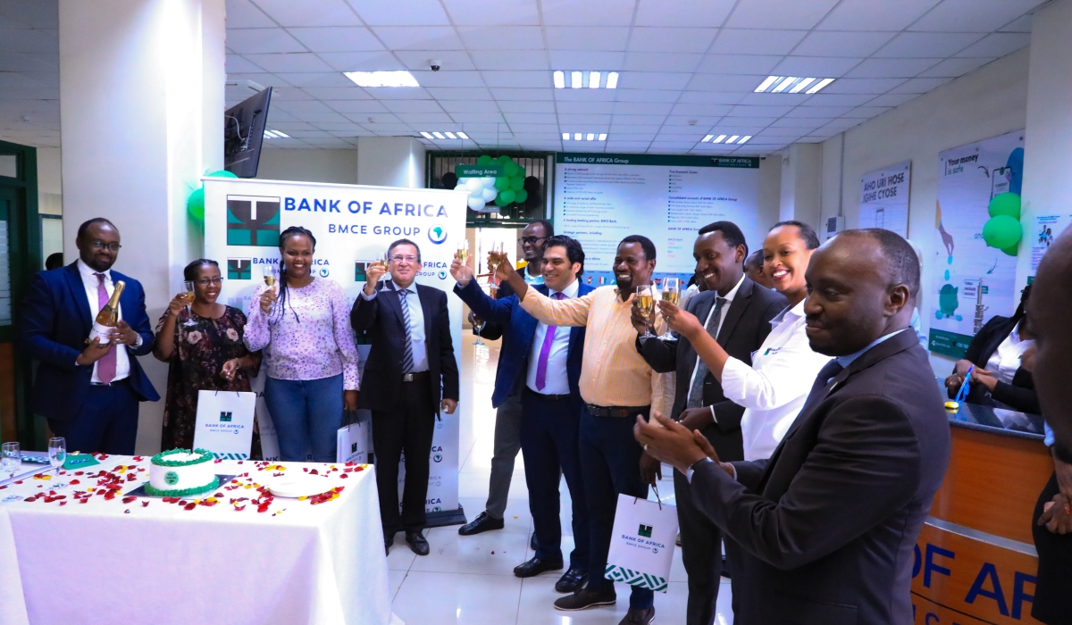 Bank officials toast with their customers during the celebration of Customer Service week in Kigali on October 6. All photos: Dan Gatsinzi