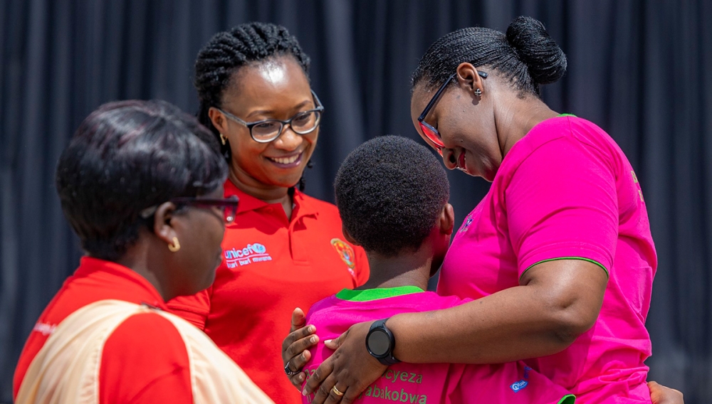 First Lady Jeannette Kagame awards one of the 784 best performing school girls  during the celebration of the  10th anniversary of the International Day of the Girl, in Musanze District  October 11. Courtesy