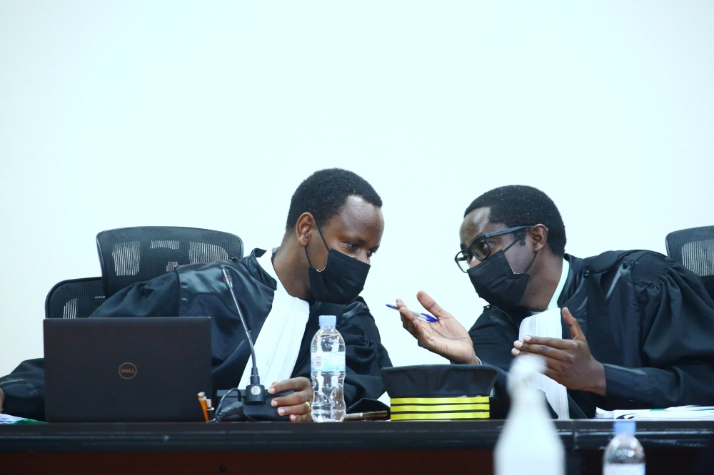 Judge François Regis Rukundakuvuga consults with Judge Emmanuel Kamere during a hearing session at the FLN terror case on January 17,2022. Photo by Sam Ngendahimana