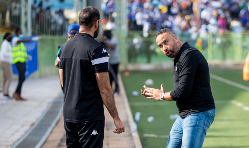 APR head coach Adil Mohammed gives briefing to his assistant during the game. Adil told the media that "In APR FC, we don&#039;t have lots of good players because a good player is a productive one". Photo by  Olivier Mugwiza