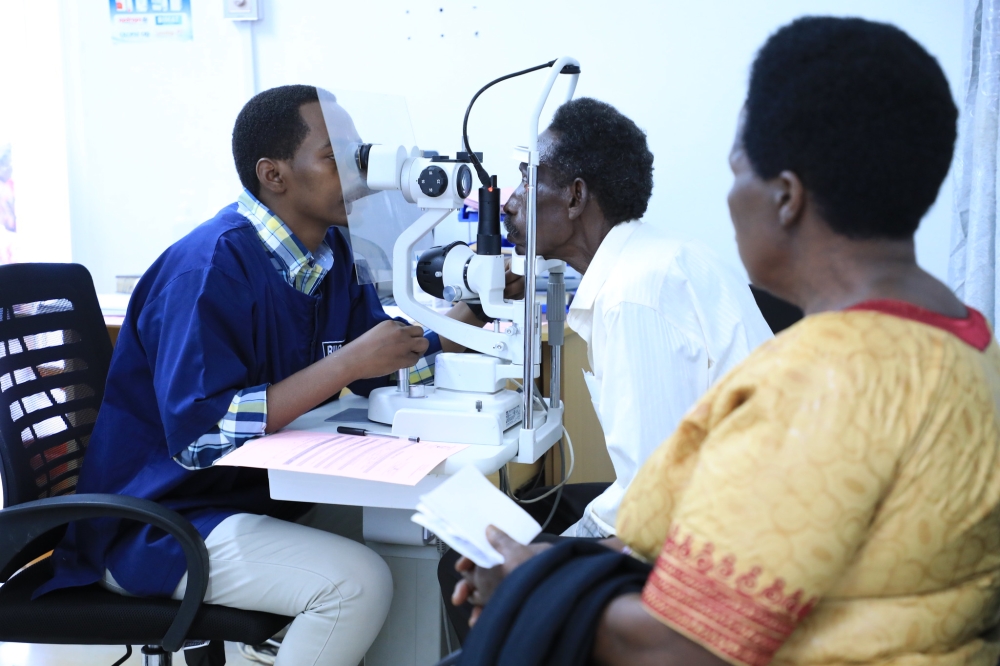 A doctor conducts eye screening at Masaka Hospital in Kicukiro District on October 13. Ministry of Health will carry out at least 1,000 cataract surgery on patients during an exercise slated to take place from October 13 to November 30. All Photos by Craish Bahizi