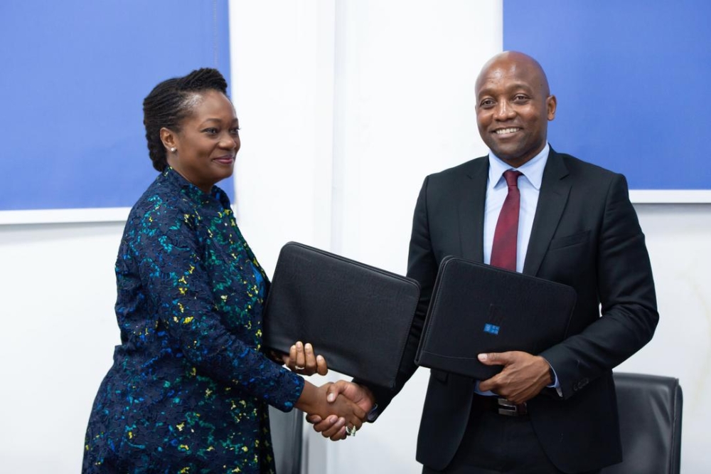 Chief Executive Officer of TEF foundation, Ifeyinwa Ugochukwu and Maxwell Gomera, UNDP Resident Representative after signing  a funding agreement on October13. Courtesy