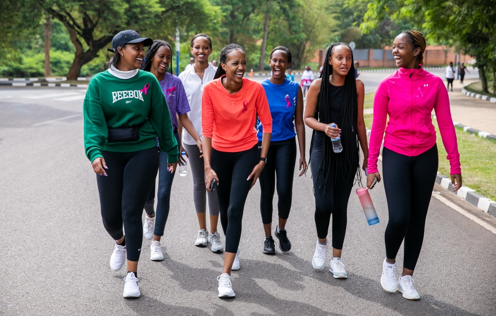 Miss Iradukunda and Miss Muheto flanked with other girls during the Kigali Car Free Day on Sunday, October 16. Captured here share a moment during a walking exercise. Olivier Mugwiza