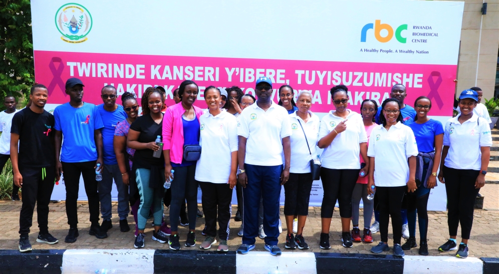 Dr Daniel Ngamije, Minister of Health, in group photo with other participants after the mass sports exercise that raised awareness on Breast Cancer on Sunday . Craish Bahizi
