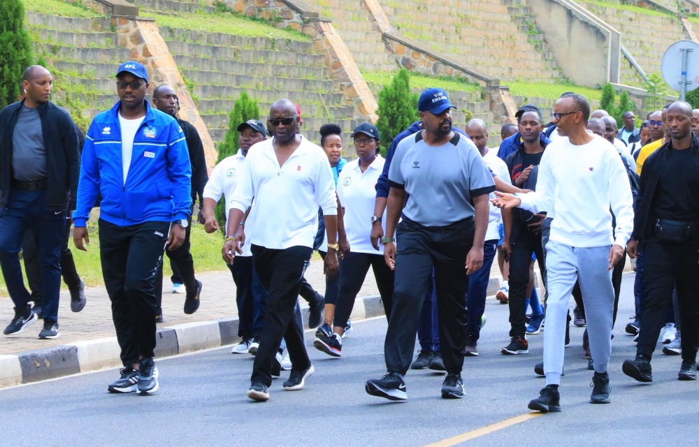 President Kagame interacts with General Muhoozi Kainerugaba during Car Free Day mass sports in Kigali on October 16. Olivier Mugwiza