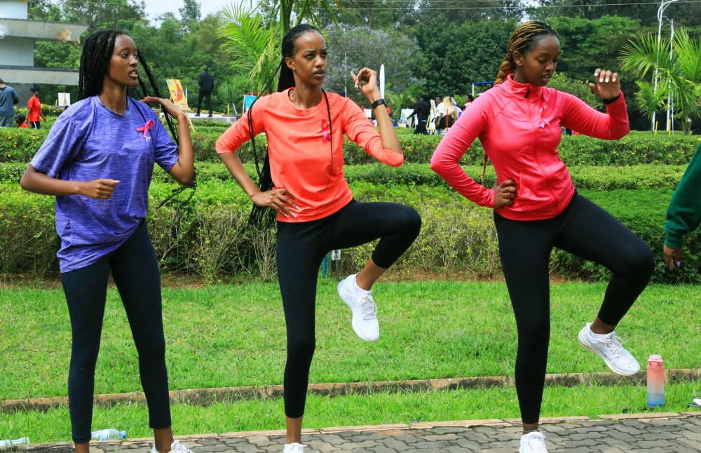 Miss Rwanda 2017, Elsa Iradukunda (C) during the exercise .The Sunday's event coincided with this year's Breast Cancer Awareness Walk, as part of the activities to mark the Breast Cancer Awareness month.