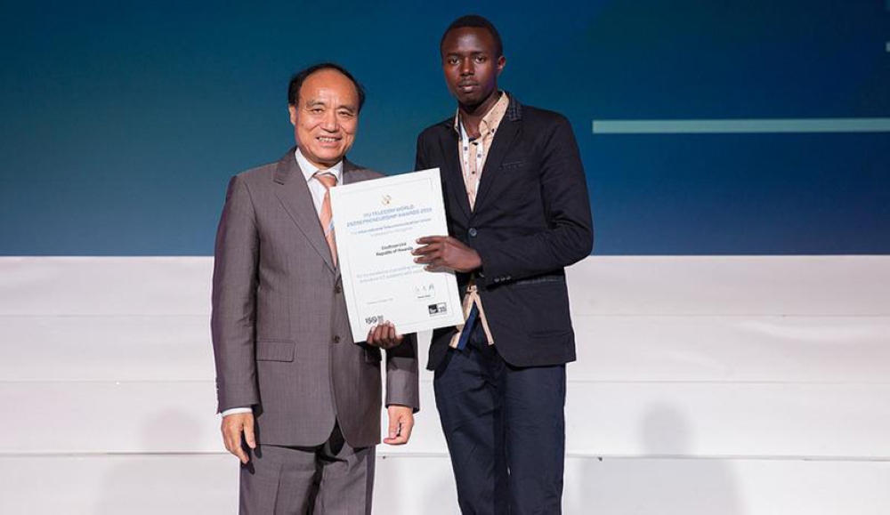 Serge Tuyihimbaze receives the 2015 Entrepreneurship Award from Houlin Zhao, Secretary General of the International Telecommunication Union. The award is given to people who promoted innovative ICT Solutions with social impact. Photo: Courtesy.