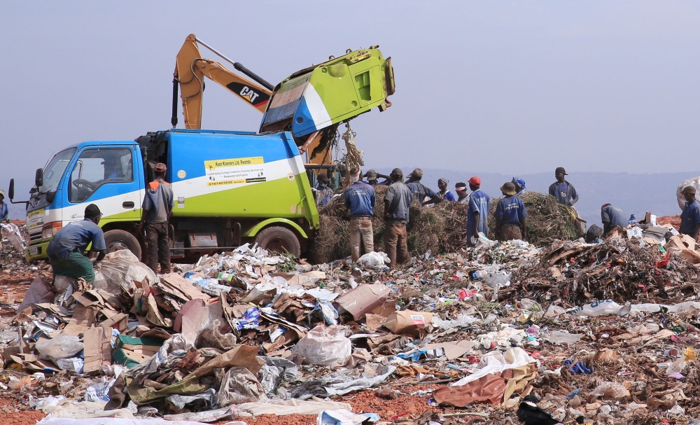 Workers sort garbage at Nduba landfill in Gasabo District in Kigali on August 27, 2019. Rwanda is looking to invest $28 million in landfill gas production for cooking and lighting. Photo: File.