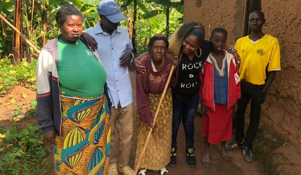 Josephine Birungi (in black), poses for a photo with some of her relatives. Photos/Courtesy