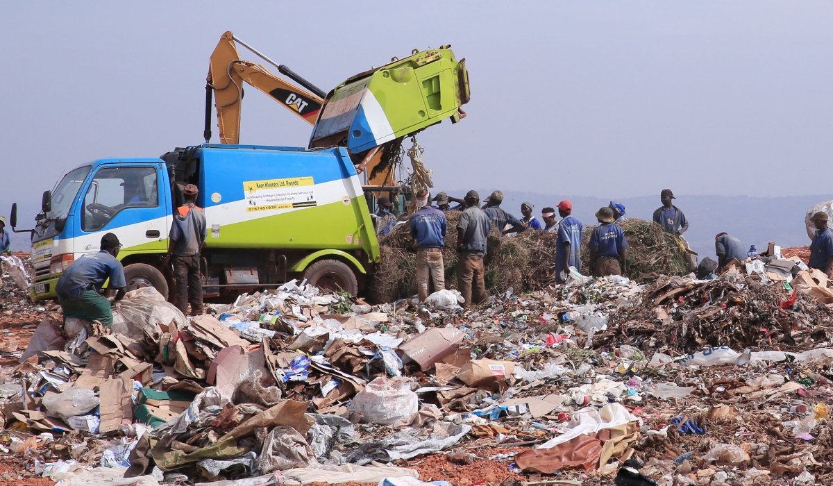 Workers sort garbage at Nduba landfill in Gasabo District in Kigali on August 27, 2019. Rwanda is looking to invest $28 million in landfill gas production for cooking and lighting. Photo: File.