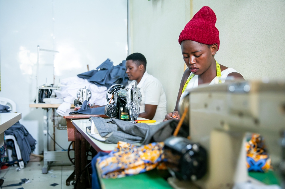 Workers tailoring at Phos Garment Group factory. Olivier Mugwiza.