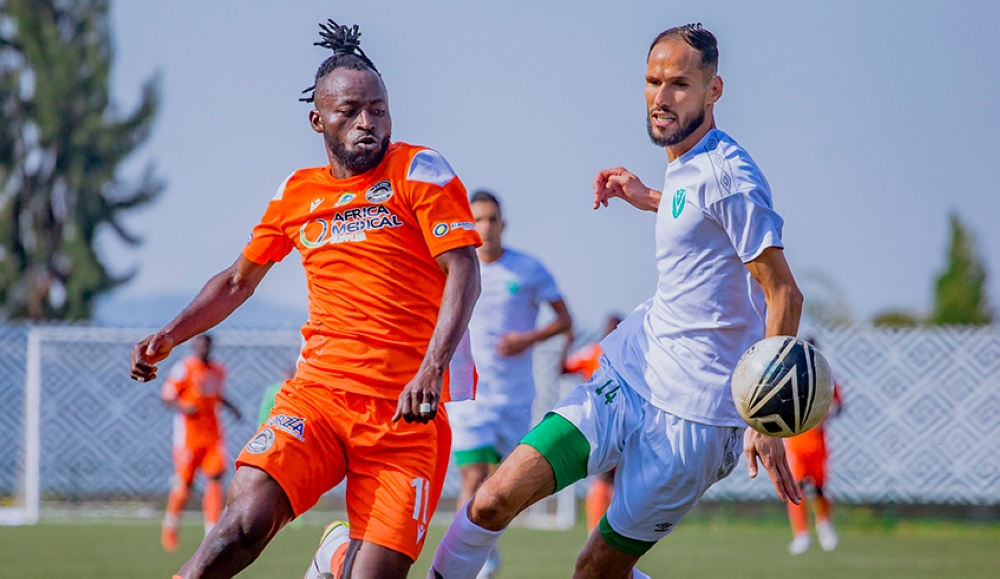 AS Kigali striker Shaban Hussein Shabalala dribbles past Al Nasr defender during the return leg goalless draw at Huye Stadium on Saturday, October 15. Photo: Courtesy.