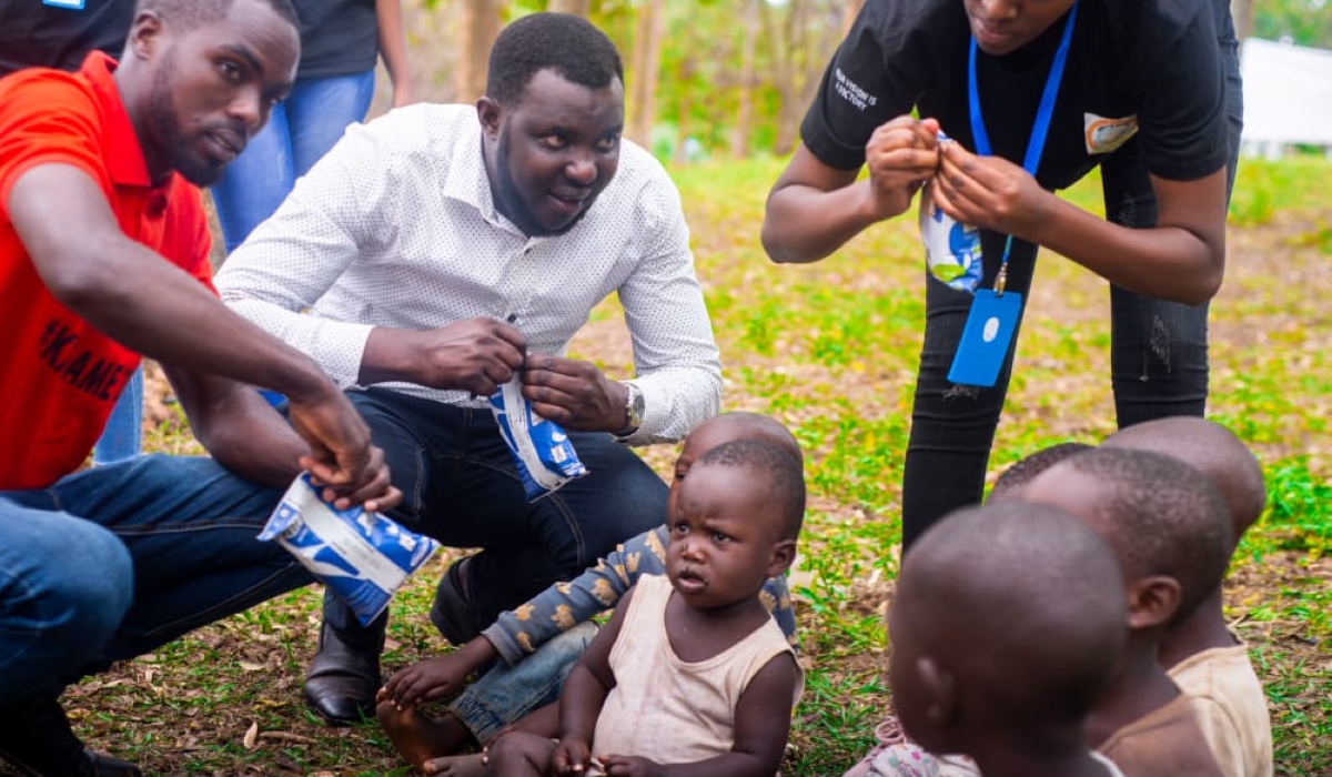 John Mungaruriye and his team feed children of teen mothers milk in Nyagatare District.