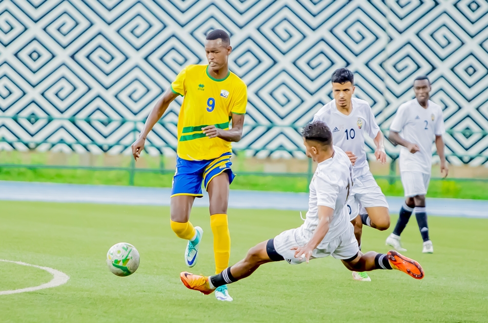 The U-23 National football team striker Prince Rudasingwa does past Libya defenders. Prince is among top five players to watch as Rwanda face Mali. Courtesy
