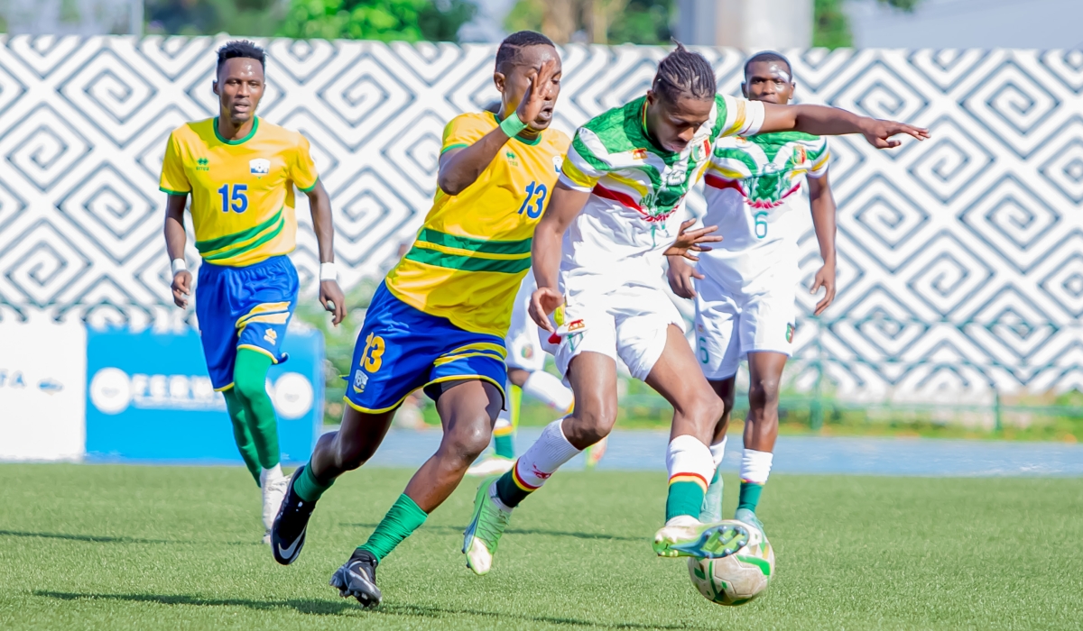 A Malian player wins the ball against the U-23 National football ball players during the first leg match at Huye Stadium on Saturday, October 22. Photo: Courtesy.