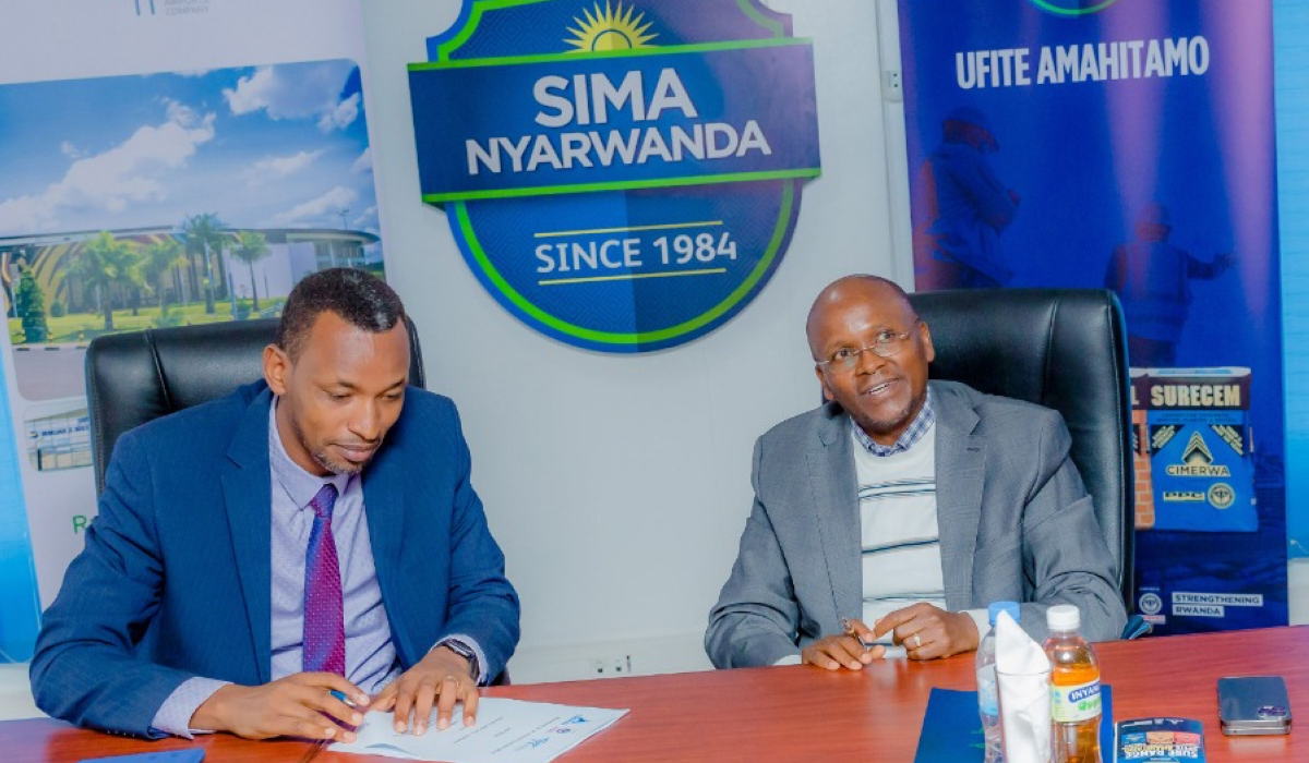 Albert Sigei, Chief Executive at CIMERWA Plc and Charles Habonimana, Managing Director at RAC sign the agreement in Kigali on October 19. Courtesy
