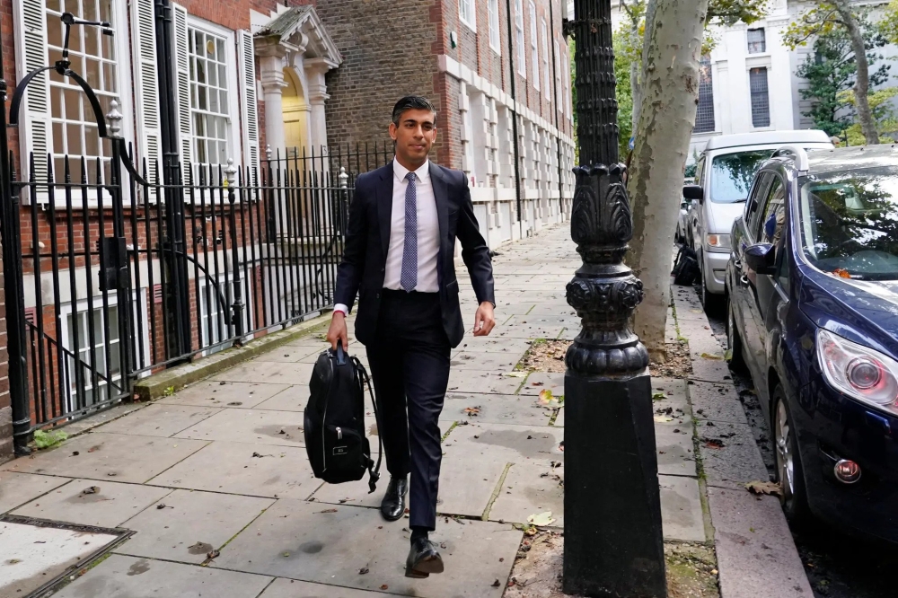 Rishi Sunak leaving the campaign office in London on Monday. / Credit: Aberto Pezzali/Associated Press