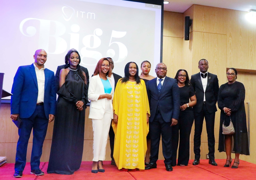 Minister of Labour Fanfan Rwanyindo in a group photo with staff of ITM Rwanda during the celebration event named ITM Big 5 at Kigali Marriot Hotel on Friday, October 21. Photos: Dan Gatsinzi.