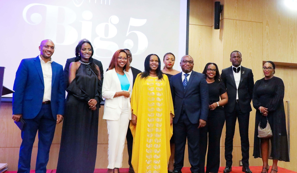 Minister of Labour Fanfan Rwanyindo in a group photo with staff of ITM Rwanda during the celebration event named ITM Big 5 at Kigali Marriot Hotel on Friday, October 21. Photos: Dan Gatsinzi.