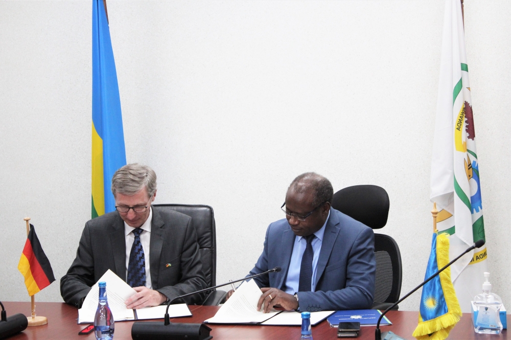 Simon Koppers, Head of Division, German Federal Ministry for Economic Cooperation and Development (BMZ), and Uzziel Ndagijimana, the Minister of Finance and Economic Planning sign the agreement in Kigali on October 26. Courtesy