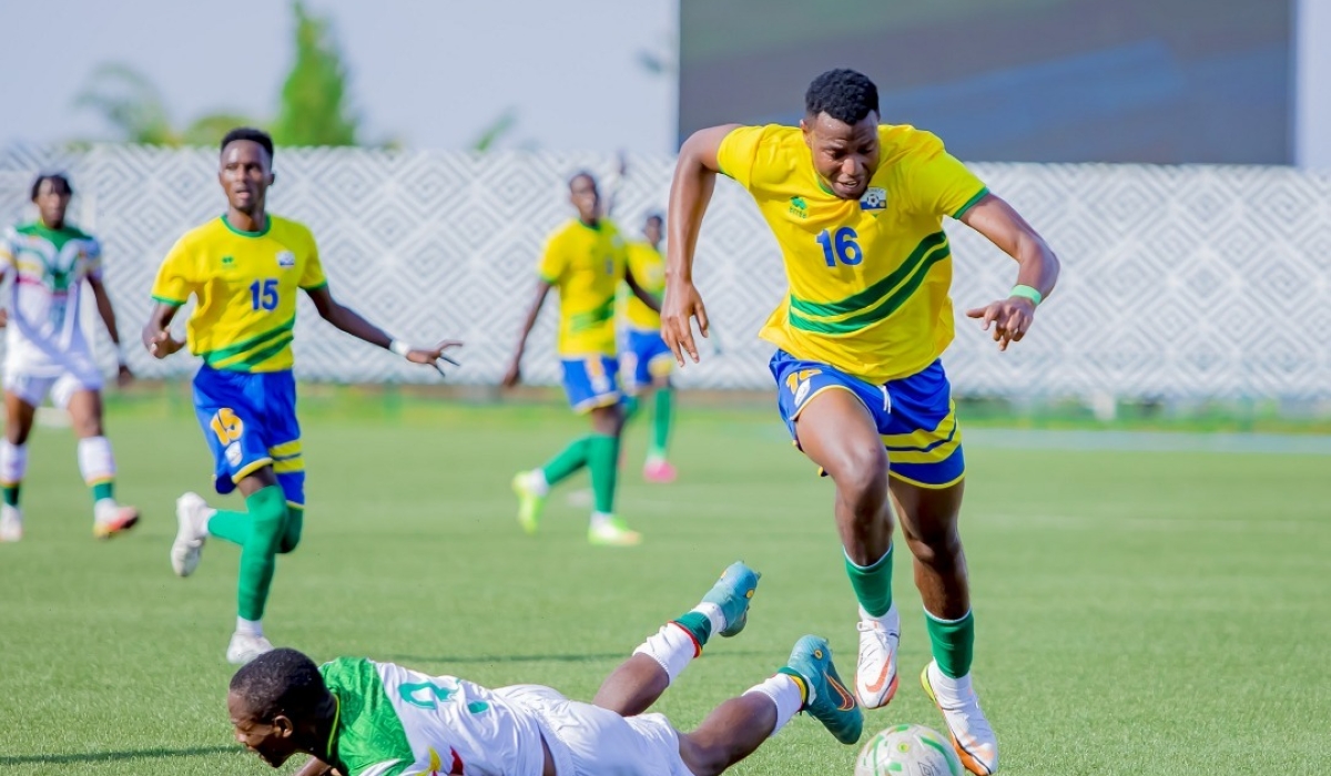 The U-23 National Football Team midfielder Arthur Gitego wins the ball against Malian defender during a 1-1 draw at Huye stadium. Photo: Courtesy.