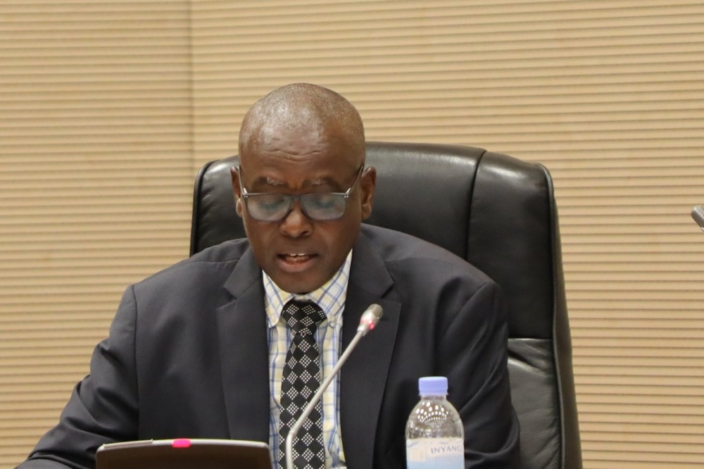 Barnabé Muhire Sebagabo, Acting Chairperson of the Council of Commissioners at the National Public Service Commission presenting the report to the parliament. Courtesy