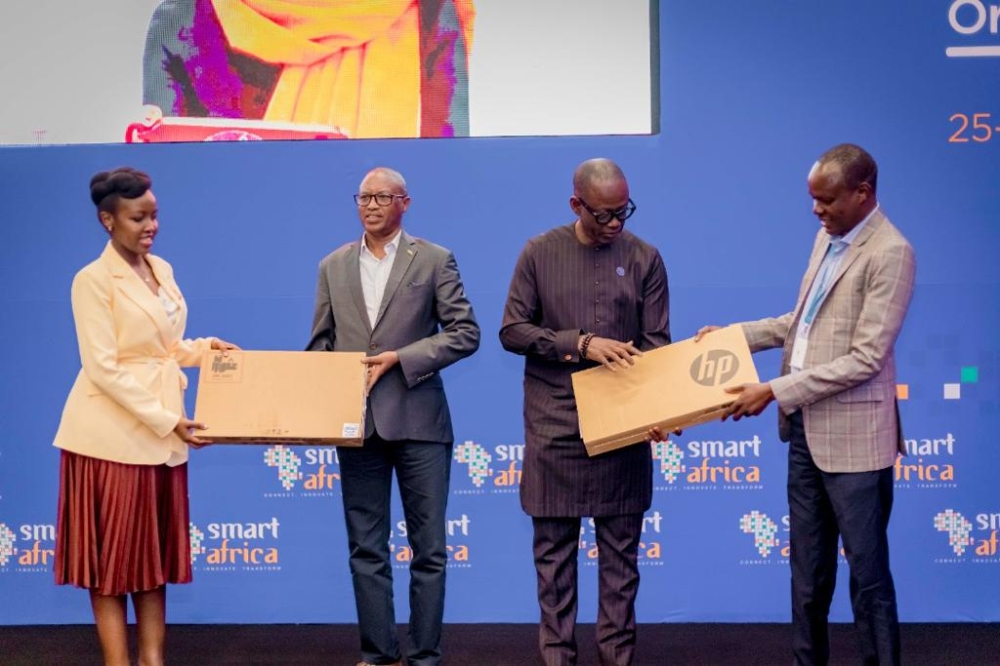 Minister Paula Ingabire during the hand over of laptos on October 26. Smart Africa has donated 105 laptops to support access to information for teachers and students. Courtesy