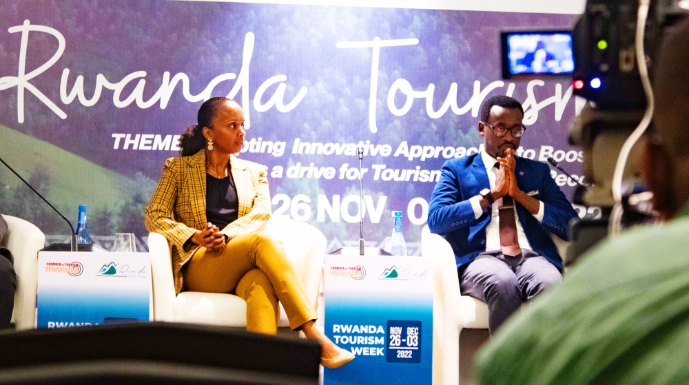 Frank Gisha Mugisha, the Director General of Rwanda Chamber of Tourism(Right) briefs the media on the upcoming Tourism week . Photo by  Dan Kwizera Gatsinzi