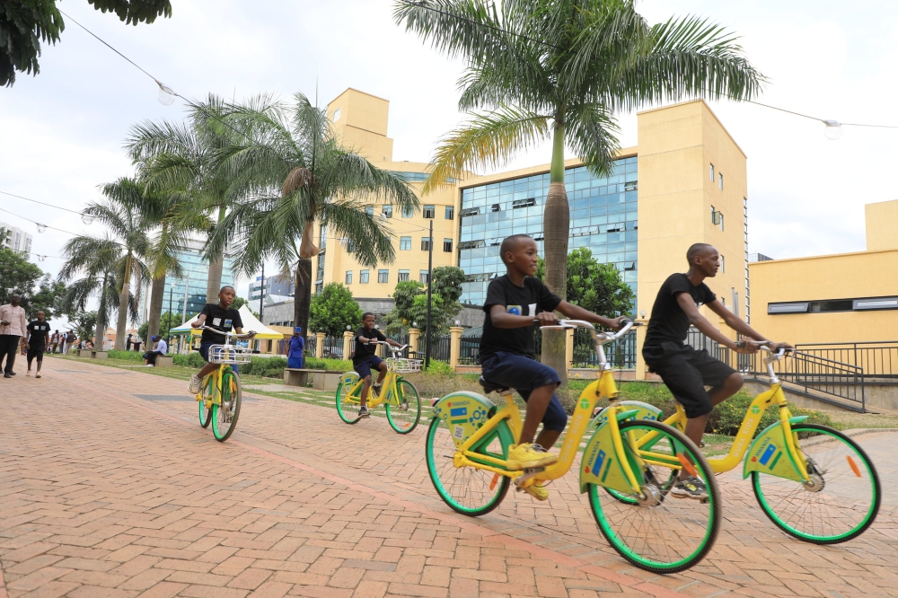 Children ride bicycles during the celebration of World Cities Day that was held under the theme &#039;Act Local to Go Global&#039; at Imbuga City Walk in Kigali on October 31. Photo by Craish Bahizi