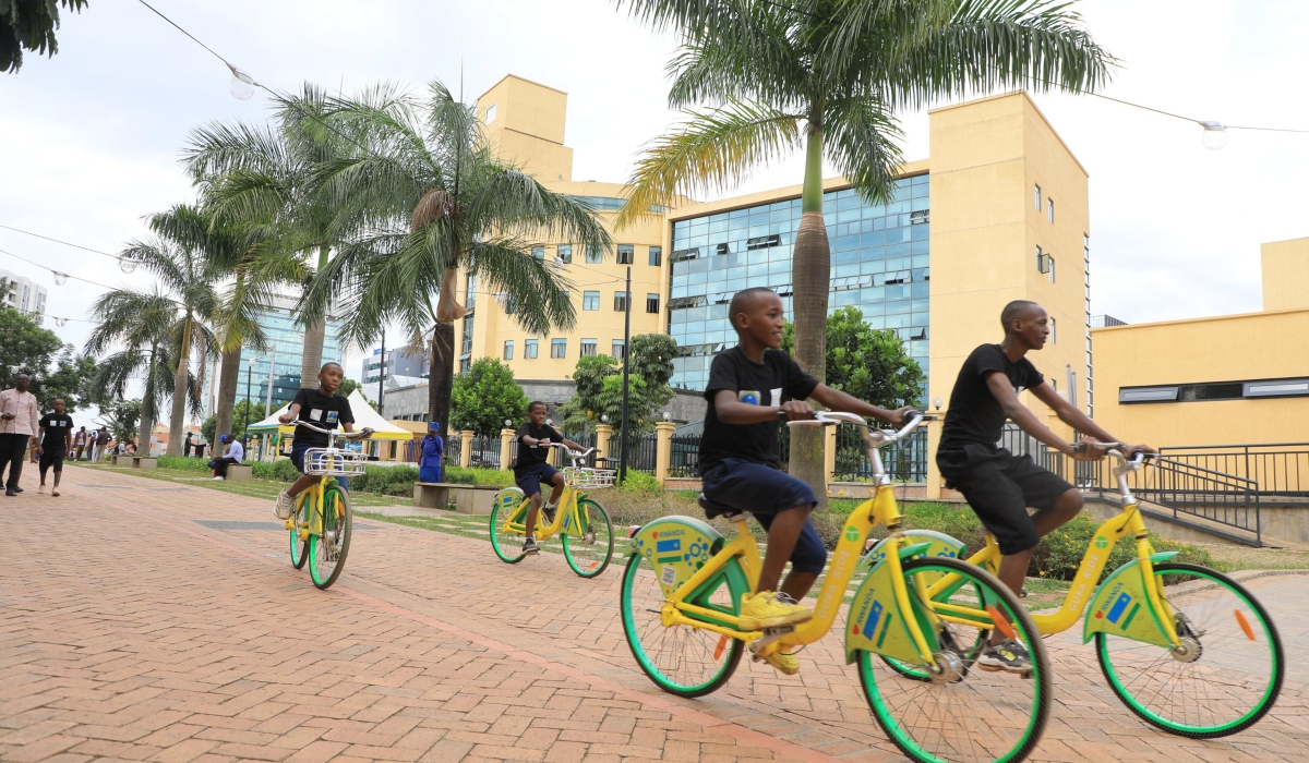Children ride bicycles during the celebration of World Cities Day that was held under the theme &#039;Act Local to Go Global&#039; at Imbuga City Walk in Kigali on October 31. Photo by Craish Bahizi