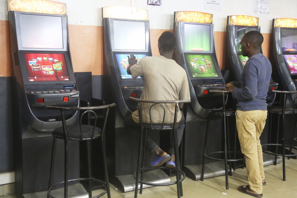 Gamblers playing on slot machines for betting business at Kisimenti in Kigali on April 16, 2019. Craish Bahizi