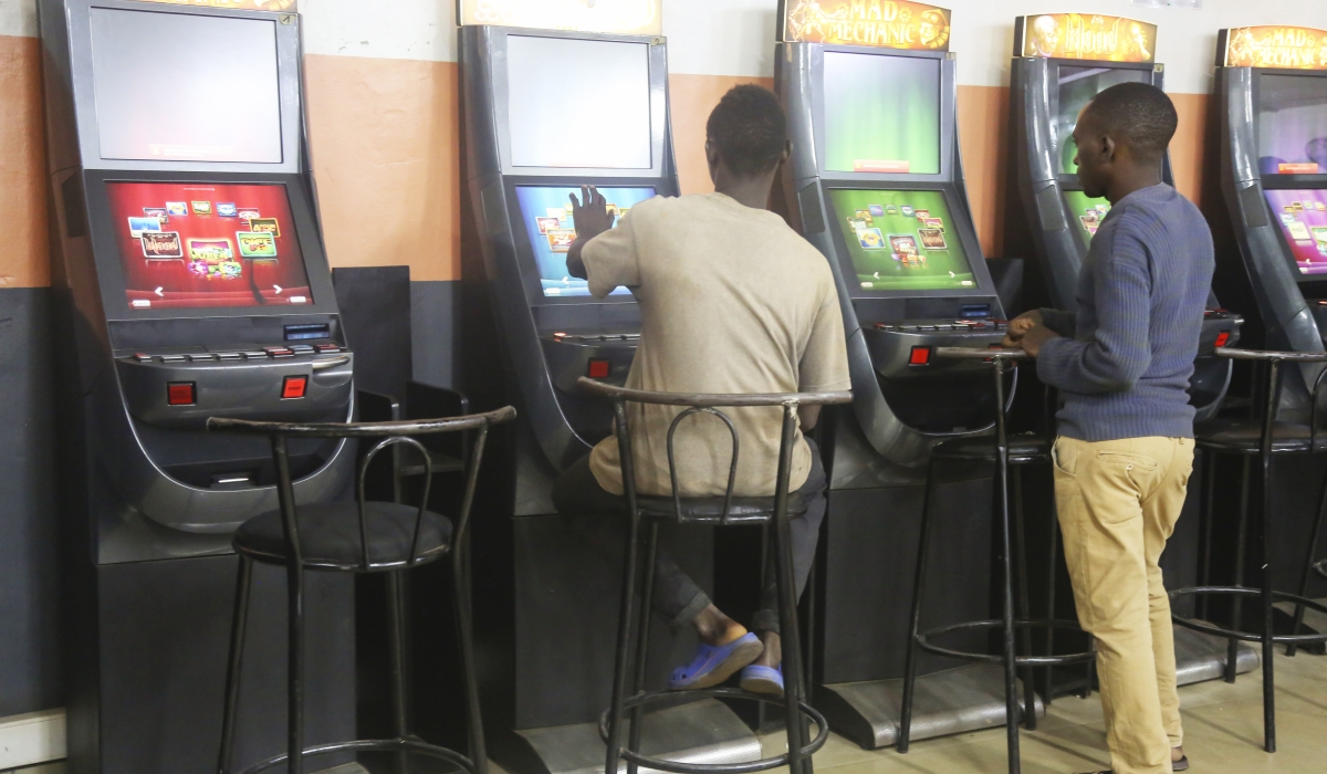 Gamblers playing on slot machines for betting business at Kisimenti in Kigali on April 16, 2019. Craish Bahizi