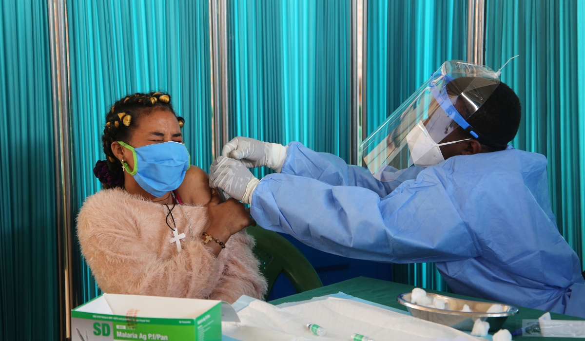 A health worker administers a Covid-19 jab in Bugesera District. Photo: Craish Bahizi.