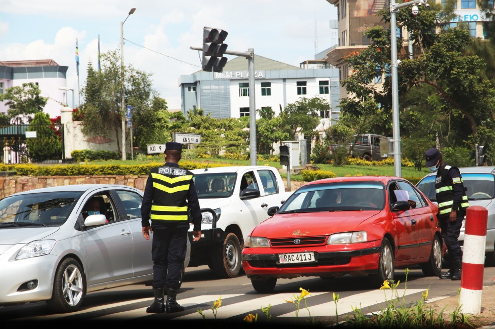 Rwanda National Police&#039;s Traffic and Road Safety Department officers inspect drivers at Gishushu road junction in Kigali. Photo by Craish Bahizi