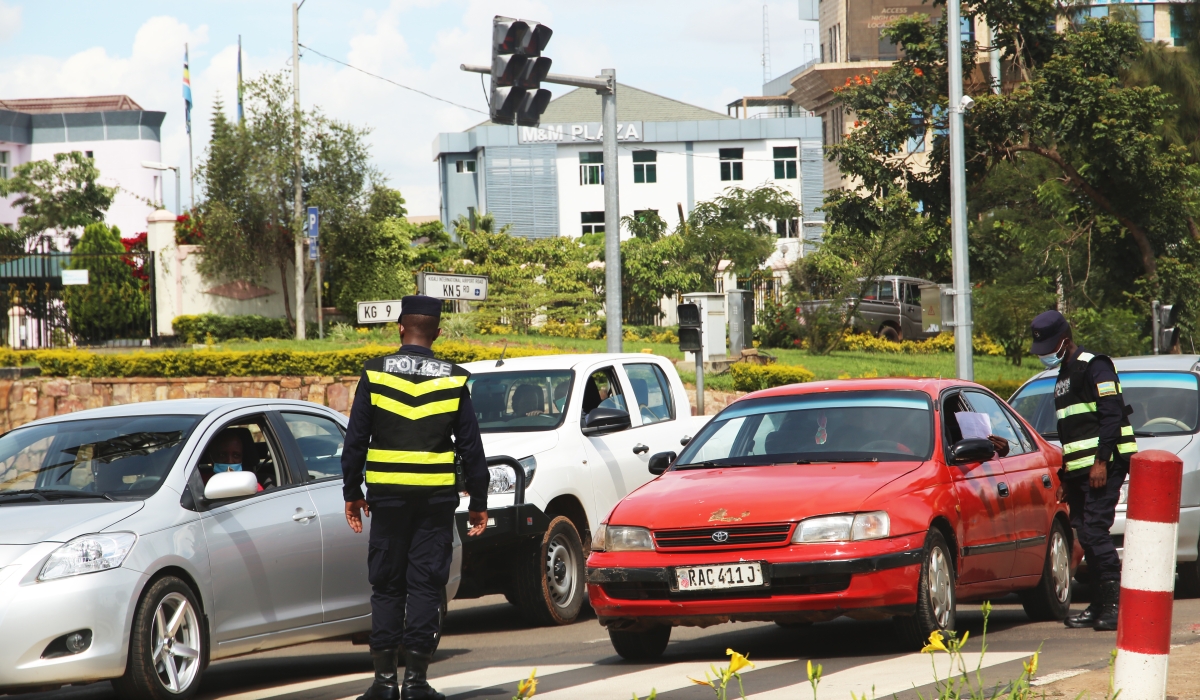 Rwanda National Police&#039;s Traffic and Road Safety Department officers inspect drivers at Gishushu road junction in Kigali. Photo by Craish Bahizi