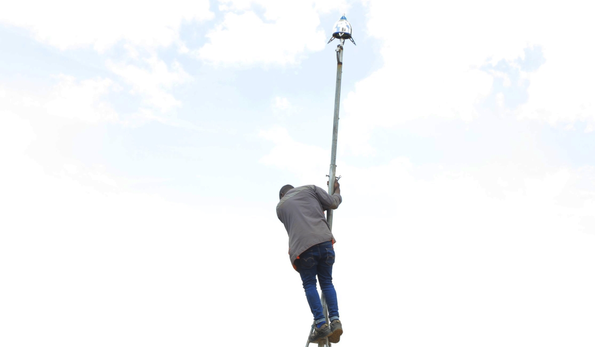A technician installs one of many lightning conductors that are being installed in Rutsiro District on November 4. Photo: Courtesy.