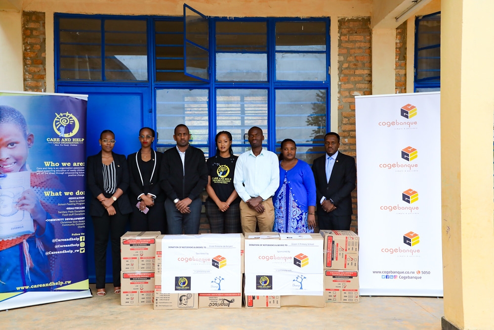 Cogebanque Plc , Care and Help Child Organization and Umurage organization staff in group photo during the handover ceremony of the support. All photos by Dan Kwizera