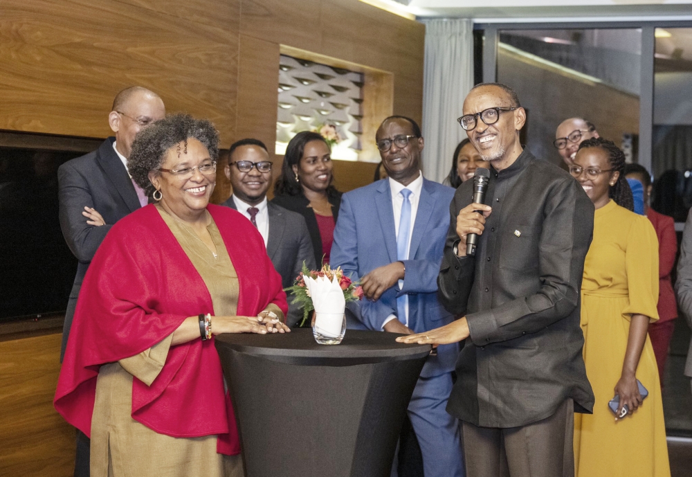 President Paul Kagame and Barbados Prime Minister, Mia Amor Motley share a moment as  He speaks at a reception event at Kigali Convention Centre on November 10. Photo by Village Urugwiro