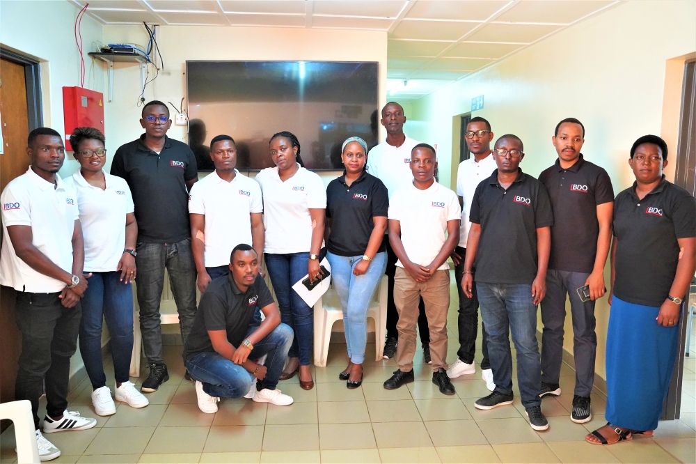 A group photo of  BDO EA Rwanda staff, an international network of audit, tax, and advisory services firms, with offices in Kacyiru’s Career Center building. Craish Bahizi.