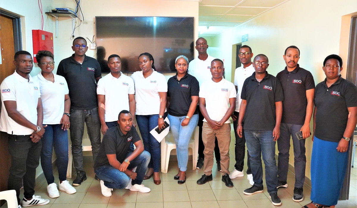 A group photo of  BDO EA Rwanda staff, an international network of audit, tax, and advisory services firms, with offices in Kacyiru’s Career Center building. Craish Bahizi.