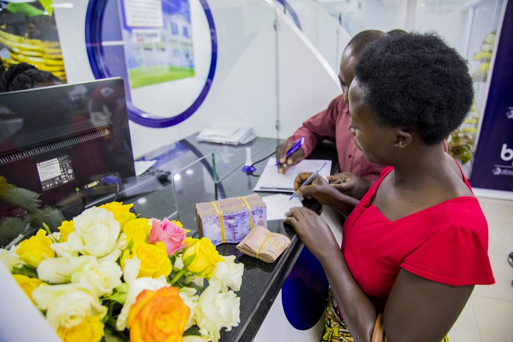 Clients at a BPR Bank Rwanda branch at Nyabugogo in Kigali. The National Bank of Rwanda on Tuesday, November 15, increased
its lending rate from 6 per cent to 6.5 per cent as part of efforts to help tame inflation. Photo: File.
