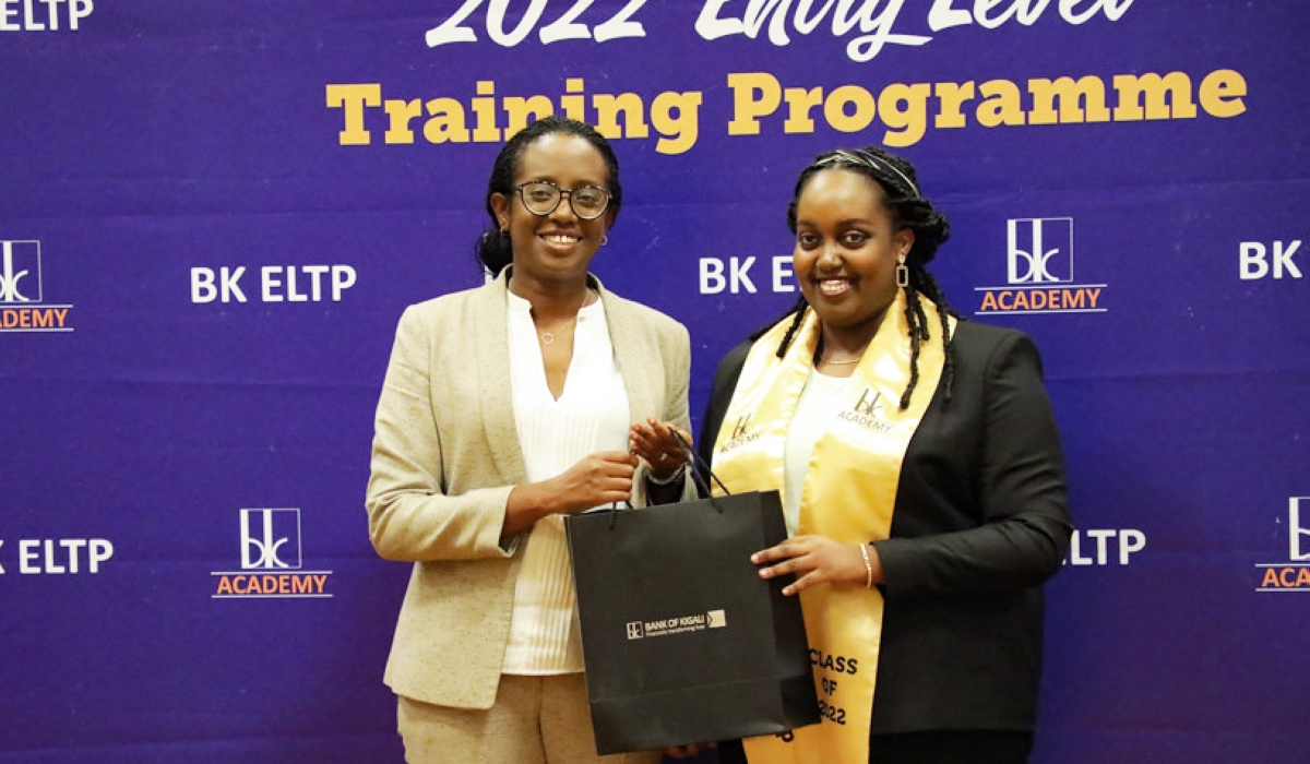 Bank of Kigali Chief Executive Officer Diane Karusisi awards one of the 25 graduates during the ceremony on Thursday, November 17