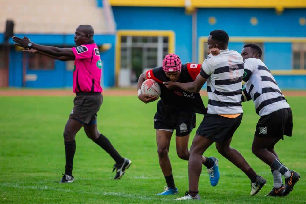 Thousand hills players vie for the ball with Kigali Sharks rugby in the final of Rwanda Seven&#039;s championship 2021 at Amahoro Nation Stadium on November 13, 2021. Photo by  Dan Nsengiyumva