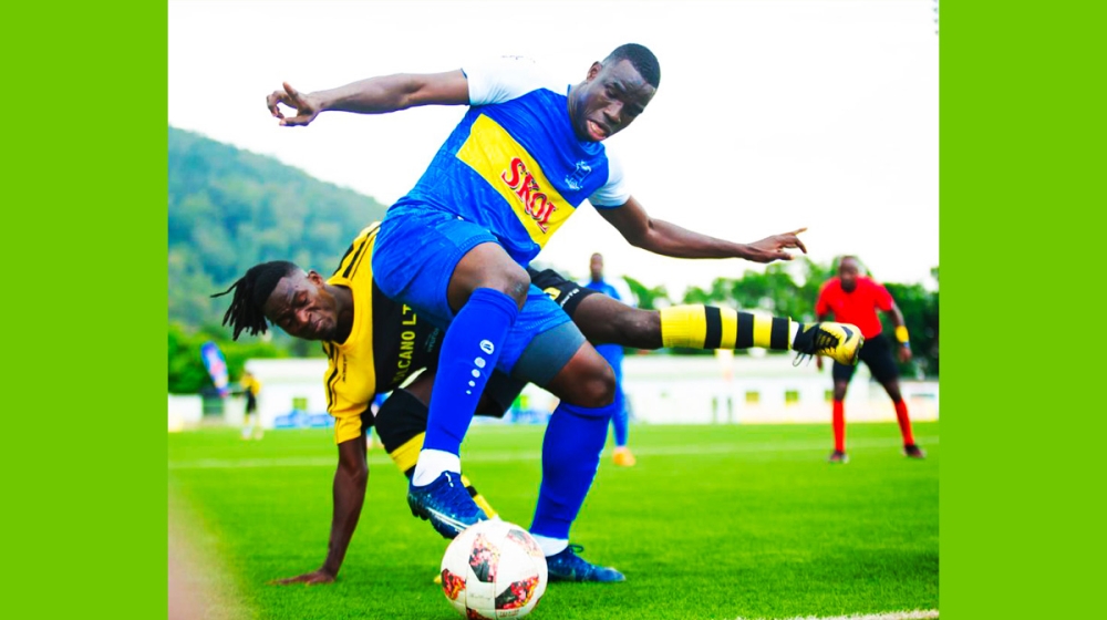 Rayon Sports striker Musa Camara controls the ball against Mukura VS defenders during a 2-2 draw league game on Sunday, November 20. Courtesy
