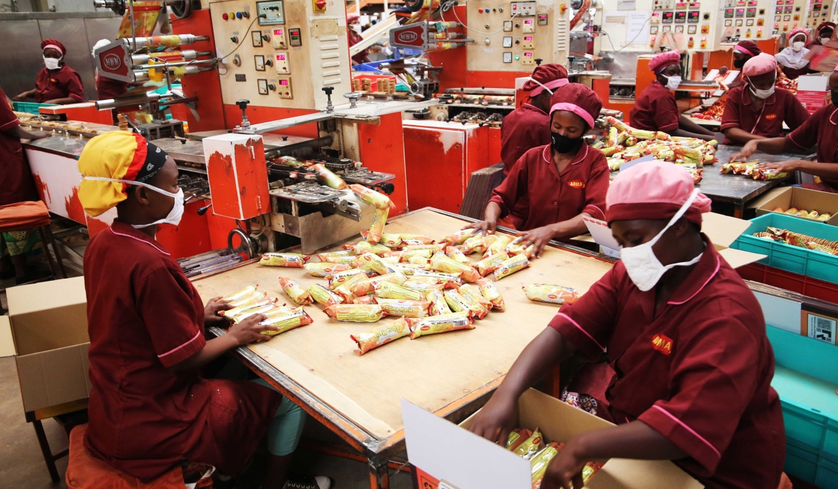 Workers pack biscuits at Adma International Ltd’s factory at Kigali Special Economic Zone in Gasabo District. Photo: Craish Bahizi.
